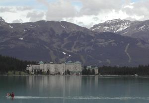 The Fairmont Chateau on Lake Louise with ski trails in the background