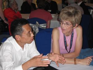 Becky and Hui meet to discuss the trip