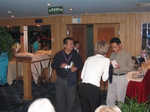 Becky presents the tour's gifts of appreciation to Gerard and Hui