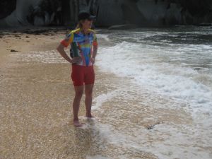 Becky takes a wade in the water at Cook's Beach